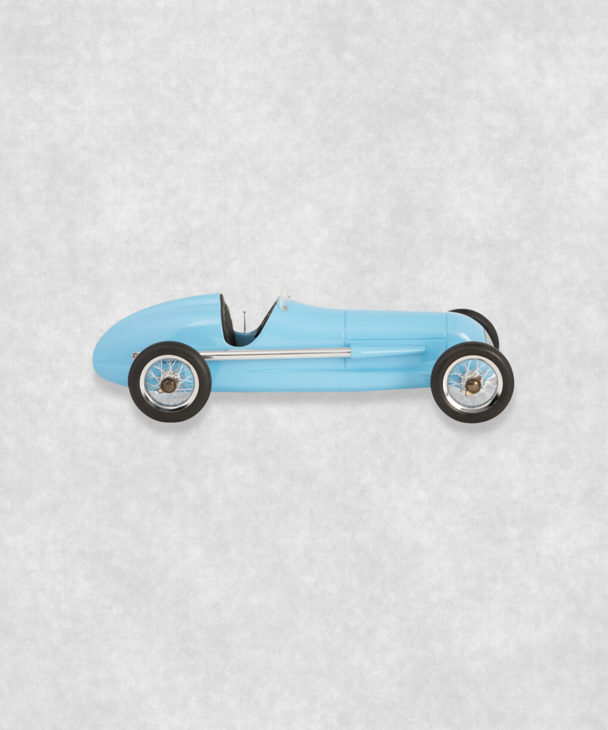 Vintage racing silberfeil car model inspired by classic Grand Prix racers and Silver Arrow legends, featuring a blue race car body with a striking black seat. A collectible car model for motorsport and classic car enthusiasts. Viewed from the right side.