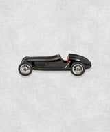 Vintage racing silberfeil car  model inspired by classic Grand Prix racers and Silver Arrow legends, featuring a sleek black race car body with a striking red seat. A collectible car model for motorsport and classic car enthusiasts. Viewed from  the right side.