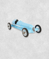 Vintage racing silberfeil car  model inspired by classic Grand Prix racers and Silver Arrow legends, featuring a blue race car body with a striking black seat. A collectible car model for motorsport and classic car enthusiasts. Viewed from a diagonal perspective.