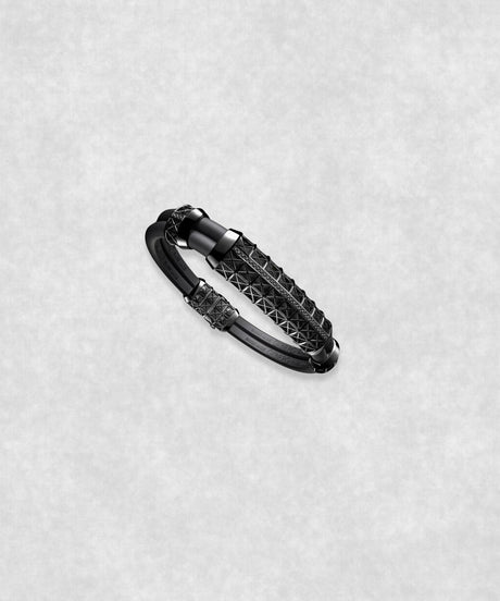 Side view of a white gold-coated bracelet featuring a large centerpiece set with 37 diamonds and a flexible black rubber band.