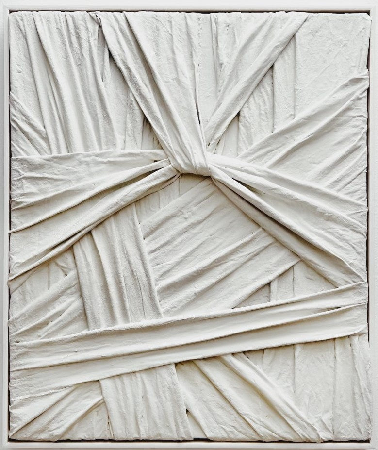 Grey sculptural wall art titled "Knot" by Sarah Kvejborg, resembling a twisted knot.